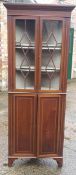 A 19th century glazed mahogany corner cabinet