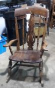 A Victorian splat back rocking chair