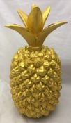 A large gold coloured pineapple