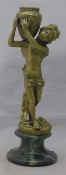 A bronze figural candlestick