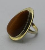 A silver and goldstone ring