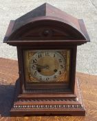 A late 19th century walnut mantle clock