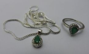 A green stone and silver pendant on chain and ring en-suite