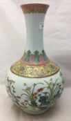 A Chinese porcelain vase decorated with flowers