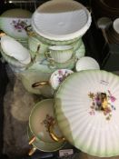 A florally decorated bone china dinner and tea service