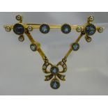 An unmarked yellow metal blue topaz and seed pearl set pendant bar brooch (5.2 grammes all in).