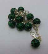 A silver and malachite bracelet