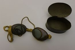 A pair of mesh goggles,