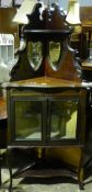 A Victorian glazed and mirrored corner cabinet