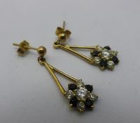 A pair of 9 ct gold paste set flowerhead drop earrings (approx 2 grammes all in)