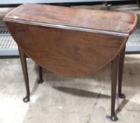 A George III mahogany crossbanded drop flap table