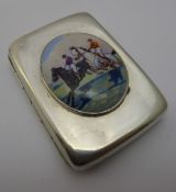 A silver cigarette case decorated with a horse racing scene