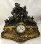 A 19th century figural mantle clock surmounted with knights