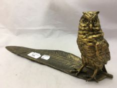 A bronze owl and feather form inkwell