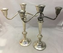 A pair of sterling silver candelabra
