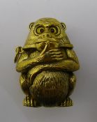 A brass vesta in the shape of a monkey