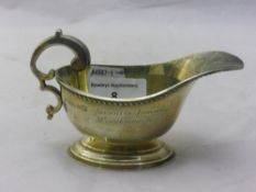 A small silver sauce boat (77 grammes)