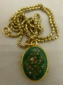 An unmarked yellow metal diamond set and enamelled photo locket on 9 K chain (11.6 grammes all in).