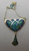 A small Art Nouveau style silver and enamel pendant