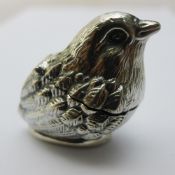 A silver vesta formed as a chick