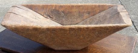 A carved wooden trug