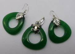 A pair of silver and jade earrings,