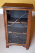 An Edwardian glazed mahogany side cabinet