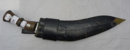 A leather sheathed Kukri