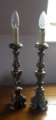 A pair of silver coloured table lamps