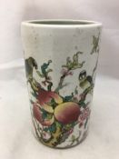 A porcelain brush pot decorated with peaches