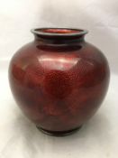 A red ground cloisonne vase