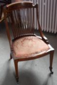 A Victorian inlaid mahogany parlour chair