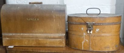 A Victorian tin hat box and a singer sewing machine