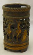 A Chinese carved and pierced bamboo brush pot worked with cranes