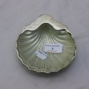 A silver shell form butter dish, with glass liner (87.