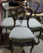 Three Victorian rosewood framed balloon back chairs