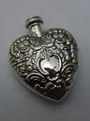 A silver heart shaped bottle/pendant