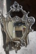 A 19th century ornately framed wall glass