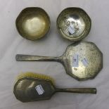 A silver hand mirror and brush,
