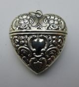 A silver embossed heart shaped box