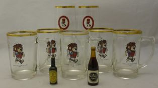 A collection of World Cup Willie drinking glasses