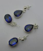 Two pairs of silver and bluestone earrings