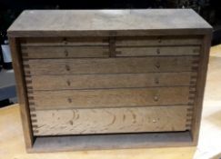 A vintage oak bank of engineers drawers