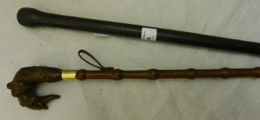 A hardwood walking cane and a moulded shooting dog handled crop