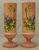 A pair of 19th century enamel painted pink glass vases