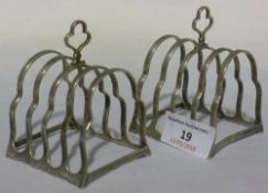 A pair of silver toast racks