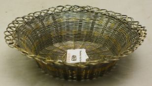 An unmarked silver wire work bowl