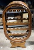 A tulip wood wine rack of oval form