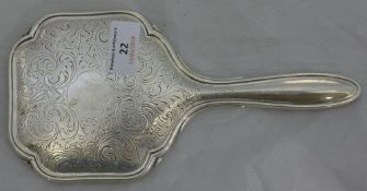 An unmarked silver hand mirror