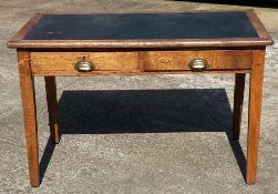 An oak writing table